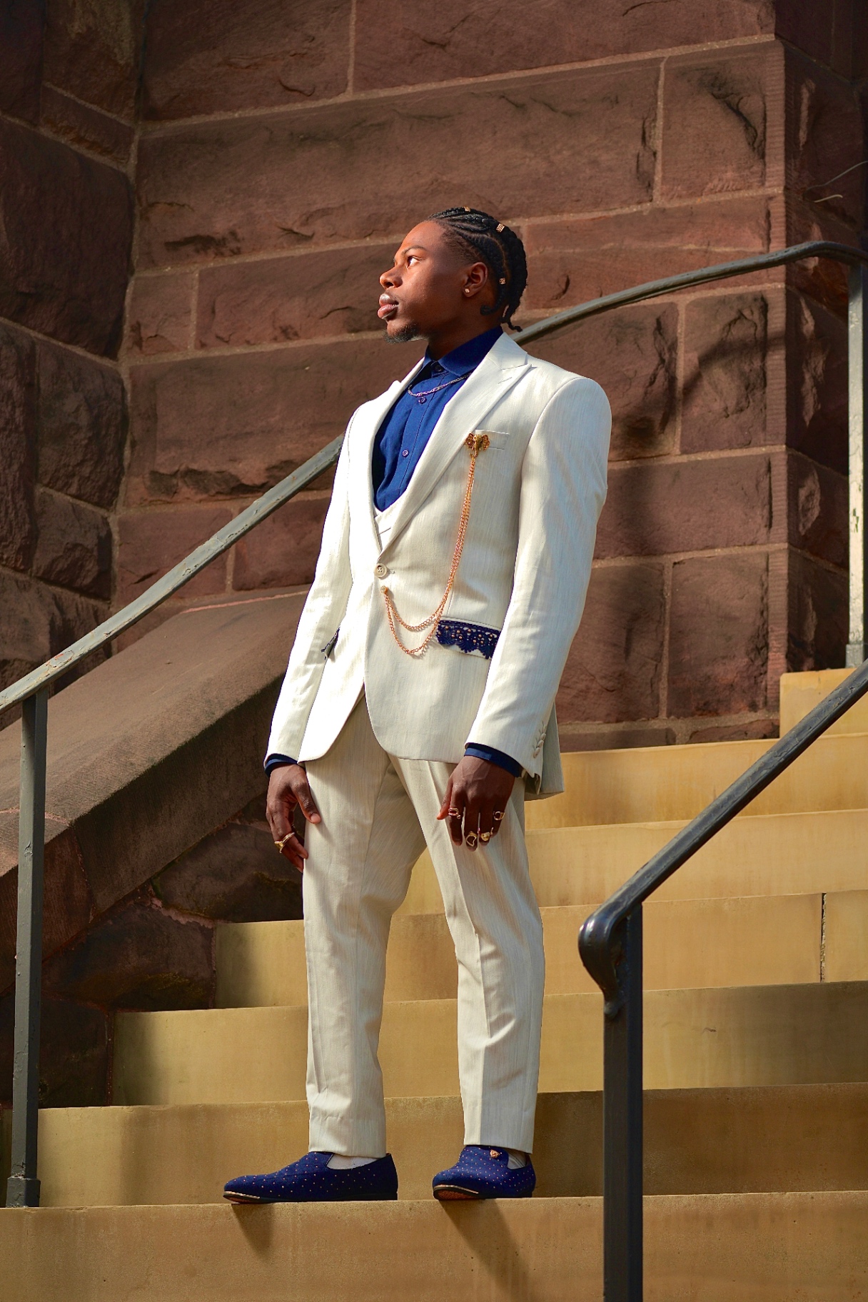 Formal portrait photographed by CAMSNAPPED on stone steps.